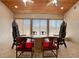 Elegant dining room with ornate chairs and large windows at 14234 River Beach Dr, Port Charlotte, FL 33953