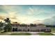 Mediterranean style home with terracotta roof and multiple garages at 14234 River Beach Dr, Port Charlotte, FL 33953