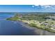 Aerial view of waterfront property with expansive backyard, large home, and private dock at 14234 River Beach Dr, Port Charlotte, FL 33953