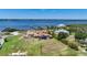 Aerial view of waterfront property with expansive backyard, large home, and private dock at 14234 River Beach Dr, Port Charlotte, FL 33953
