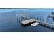 Covered boat lift and adjacent dock at 14234 River Beach Dr, Port Charlotte, FL 33953