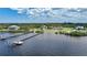 Aerial view of waterfront property with expansive backyard, large home, and private dock at 14234 River Beach Dr, Port Charlotte, FL 33953