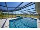 Inviting screened pool and spa with a spacious patio at 14234 River Beach Dr, Port Charlotte, FL 33953