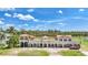 Luxury home with unique architectural design, copper roof, and expansive lawn at 14234 River Beach Dr, Port Charlotte, FL 33953