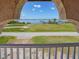 Stunning water views framed by an arched window, offering serene tranquility at 14234 River Beach Dr, Port Charlotte, FL 33953