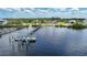 Aerial view of a waterfront property with private docks at 14234 River Beach Dr, Port Charlotte, FL 33953