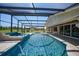 Inviting screened pool and spa with spacious patio at 14234 River Beach Dr, Port Charlotte, FL 33953