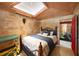 Spacious bedroom with stone feature wall and decorative accents at 14234 River Beach Dr, Port Charlotte, FL 33953