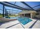 Relaxing pool and spa area with a screened enclosure at 14234 River Beach Dr, Port Charlotte, FL 33953