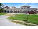 One-story home with unique architectural design, copper roof, and expansive lawn at 14234 River Beach Dr, Port Charlotte, FL 33953