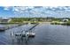 Aerial view of waterfront property with expansive backyard, large home, and private dock at 14234 River Beach Dr, Port Charlotte, FL 33953