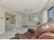 Bright living room with marble floors and built-in shelving at 570 Foxwood Blvd # 196, Englewood, FL 34223