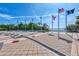 Flag plaza with several flags and views of a waterfront at 570 Foxwood Blvd # 196, Englewood, FL 34223