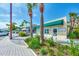 Building with green awning, landscaping, and storefront at 570 Foxwood Blvd # 196, Englewood, FL 34223