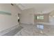 Open living room with marble floors and views to other rooms at 570 Foxwood Blvd # 196, Englewood, FL 34223