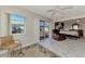 Bedroom with access to a sunroom and marble floors at 570 Foxwood Blvd # 196, Englewood, FL 34223