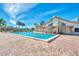 Sparkling community pool with surrounding patio at 570 Foxwood Blvd # 196, Englewood, FL 34223