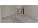 Open concept living room with marble floors and access to other rooms at 570 Foxwood Blvd # 196, Englewood, FL 34223
