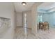 Bright entryway with marble-look flooring and access to other rooms at 570 Foxwood Blvd # 196, Englewood, FL 34223