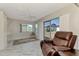 Relaxing sunroom with sliding doors and comfy chair at 570 Foxwood Blvd # 196, Englewood, FL 34223