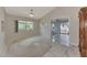 Formal dining room with carpet, tile, and access to another room at 570 Foxwood Blvd # 196, Englewood, FL 34223