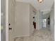 View of the entryway with a door and view to the kitchen at 570 Foxwood Blvd # 196, Englewood, FL 34223