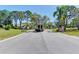 Gated community entrance with lush landscaping at 570 Foxwood Blvd # 196, Englewood, FL 34223