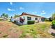 Rear view of the house showcasing the landscaping at 570 Foxwood Blvd # 196, Englewood, FL 34223