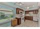 Full view of kitchen with white appliances at 570 Foxwood Blvd # 196, Englewood, FL 34223