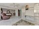 Living room with marble floors, built-in shelving, and a view to bedroom at 570 Foxwood Blvd # 196, Englewood, FL 34223