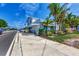 Charming white building with awning, bike rack, and lush landscaping. Located on a street with cars parked at 570 Foxwood Blvd # 196, Englewood, FL 34223