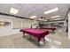 Relaxing game room with two billiard tables and a library at 570 Foxwood Blvd # 196, Englewood, FL 34223