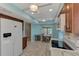 Eat-in kitchen boasts white appliances, wood cabinets and marble-look flooring at 570 Foxwood Blvd # 196, Englewood, FL 34223