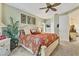 Spacious bedroom with a king-size bed and tropical decor at 2095 Lynx Run, North Port, FL 34288