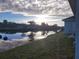 Scenic waterfront view with sunrise and reflection at 2170 Doolittle Ln, Port Charlotte, FL 33953