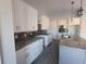 Modern kitchen with white cabinets and granite countertops at 2170 Doolittle Ln, Port Charlotte, FL 33953