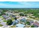 Aerial view of a quiet residential neighborhood with lush greenery and mature trees at 254 Orlando Blvd, Port Charlotte, FL 33954