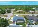 Beautiful aerial view of a home with a screened-in pool and well-manicured landscaping at 254 Orlando Blvd, Port Charlotte, FL 33954
