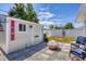 Backyard with custom shed and firepit seating area with new pavers at 254 Orlando Blvd, Port Charlotte, FL 33954