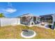 Well-maintained lawn and custom pavers in the backyard and a privacy fence at 254 Orlando Blvd, Port Charlotte, FL 33954