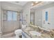 Bathroom featuring a glass enclosed shower, granite counters, and decorative mirrors at 254 Orlando Blvd, Port Charlotte, FL 33954