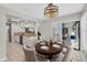 Dining area featuring a dark wood table and chairs with access to the lanai at 254 Orlando Blvd, Port Charlotte, FL 33954