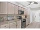 Kitchen with modern appliances, light wood cabinets and granite countertops at 254 Orlando Blvd, Port Charlotte, FL 33954