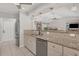 Open-concept kitchen with stainless steel appliances and granite countertops at 254 Orlando Blvd, Port Charlotte, FL 33954