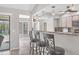 Breakfast bar with granite counters and view of the lanai and pool at 254 Orlando Blvd, Port Charlotte, FL 33954