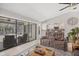 Bright living room with sliding glass doors to the pool and view into the kitchen at 254 Orlando Blvd, Port Charlotte, FL 33954