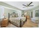 Main bedroom with ceiling fan, walk-in closet, and ensuite bathroom at 254 Orlando Blvd, Port Charlotte, FL 33954