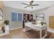 Bright office space with white desk, ceiling fan, a bookshelf, and an area rug at 254 Orlando Blvd, Port Charlotte, FL 33954