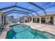 Relaxing screened-in pool with ample deck space for outdoor entertaining at 254 Orlando Blvd, Port Charlotte, FL 33954