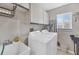 Bright laundry room, washer, dryer, and utility sink at 254 Orlando Blvd, Port Charlotte, FL 33954